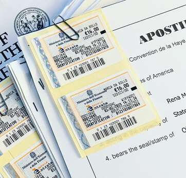 English to Italian sworn translations with 16 euro revenue stamps being prepared for court appointment in Tuscany.