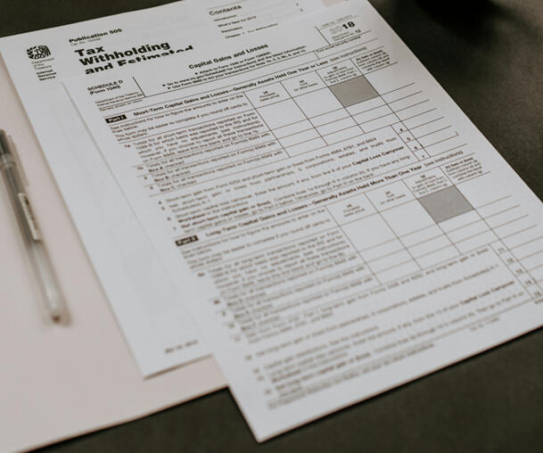 Border control officer reviewing visas and documents for entry into Italy.